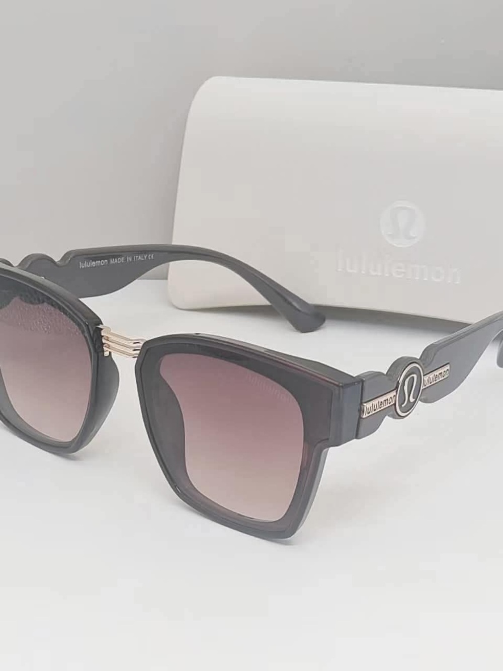 lululemon athletica Black Frame Sunglasses with Gradient Pink Lenses